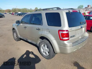 2010 Ford Escape XLT with VIN 1FMCU9D75AKB64794, listed as a IAAI auction lot 42141609 with 118,791 mi miles. Bid and sale history available at carsss.com. Image 3.