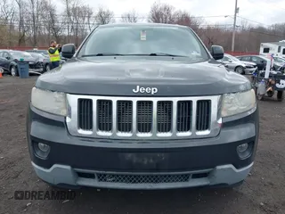 2011 Jeep Grand Cherokee Laredo with VIN 1J4RR4GGXBC597743, listed as a IAAI auction lot 41897286 with 253,111 mi miles and . Bid and sale history available at DreamBid. Image 12.