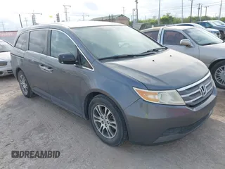 2011 Honda Odyssey EX-L z VIN 5FNRL5H68BB103322, wystawiony jako IAAI lot #42787859 z przebiegiem 217 748 mil mil oraz . Historia ofert i sprzedaży dostępna na DreamBid. Obrazek 1.