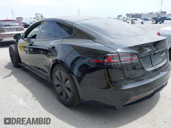 2023 Tesla Model S with VIN 5YJSA1E52PF528795, listed as a IAAI auction lot 42110660 with 21,243 mi miles and . Bid and sale history available at DreamBid. Image 3.