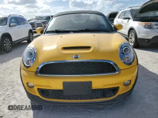 2015 MINI Roadster S z VIN WMWSY3C53FT595389, wystawiony jako Copart lot #77476814 z przebiegiem Nie podano mil oraz Szkody całkowita. Historia ofert i sprzedaży dostępna na DreamBid. Obrazek 5.