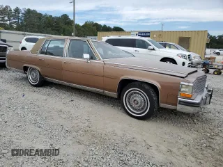 1988 Cadillac Brougham z VIN 1G6DW51Y5J9727006, wystawiony jako Copart lot #70573614 z przebiegiem 34 628 mil mil oraz Szkody całkowita. Historia ofert i sprzedaży dostępna na DreamBid. Obrazek 4.
