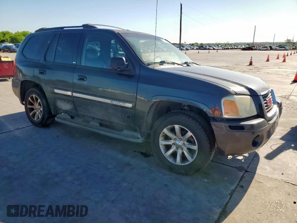 2003 GMC Envoy SLT z VIN 1GKDS13S332281271, wystawiony jako Copart lot #53685775 z przebiegiem 236 997 mil mil oraz Szkody całkowita. Historia ofert i sprzedaży dostępna na DreamBid. Obrazek 4.