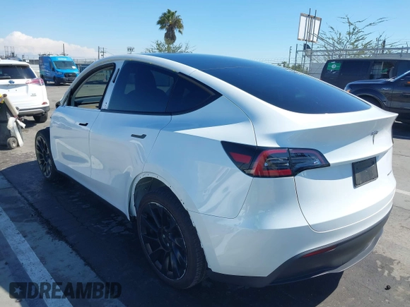 2023 Tesla Model Y Long Range with VIN 7SAYGDEEXPA129790, listed as a IAAI auction lot 41735721 with 20,402 mi miles and . Bid and sale history available at DreamBid. Image 3.