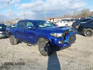 2023 Toyota Tacoma 4WD SR with VIN 3TYCZ5AN1PT119133, listed as a IAAI auction lot 41574906 with 19,887 mi miles. Bid and sale history available at carsss.com. Image 1.