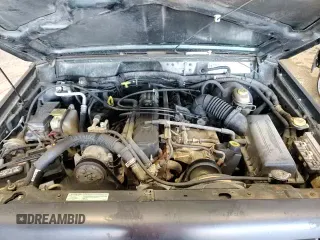 1998 Jeep Grand Cherokee with VIN 1J4FJ27P2WL203592, listed as a Copart auction lot 82803884 with 82,604 mi miles and Salvage title. Bid and sale history available at DreamBid. Image 13.