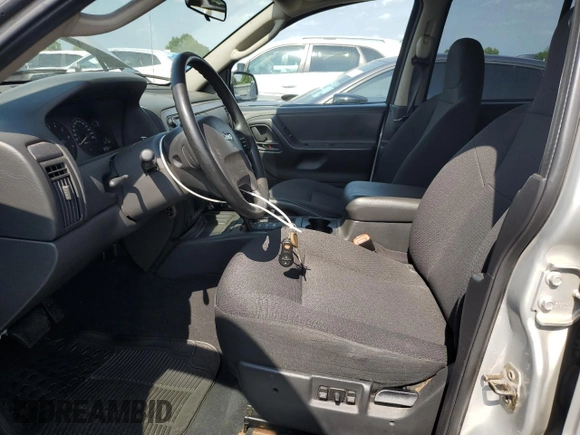 2004 Jeep Grand Cherokee Laredo with VIN 1J4GW48S44C282992, listed as a Copart auction lot 61523685 with 112,486 mi miles and Clean title. Bid and sale history available at DreamBid. Image 7.