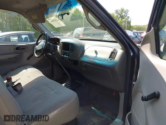 2000 Ford F-150 XL with VIN 1FTZX1723YNB00043, listed as a IAAI auction lot 42215601 with Not provided miles and . Bid and sale history available at DreamBid. Image 5.