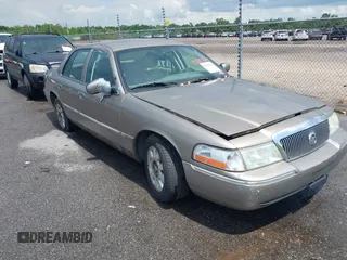 2005 Mercury Grand Marquis LS Premium z VIN 2MEFM75W65X661527, wystawiony jako IAAI lot #42548621 z przebiegiem 110 586 mil mil oraz . Historia ofert i sprzedaży dostępna na DreamBid. Obrazek 1.