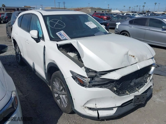 2021 Mazda CX-5 Grand Touring with VIN JM3KFADM2M0306706, listed as a IAAI auction lot 41774357 with 41,117 mi miles. Bid and sale history available at carsss.com. Image 1.