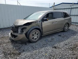 2012 Honda Odyssey Touring with VIN 5FNRL5H98CB015804, listed as a Copart auction lot 64494005 with Not provided miles and Salvage title. Bid and sale history available at DreamBid. Image 1.