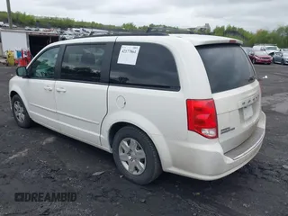 2011 Dodge Grand Caravan SXT with VIN 2D4RN4DGXBR633009, listed as a IAAI auction lot 42177861 with 119,901 mi miles and . Bid and sale history available at DreamBid. Image 3.