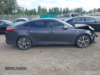 2016 Kia Optima SX Turbo z VIN 5XXGW4L28GG010897, wystawiony jako IAAI lot #42703779 z przebiegiem 121 918 mil mil oraz . Historia ofert i sprzedaży dostępna na DreamBid. Obrazek 14.