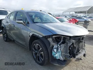 2021 Lexus UX with VIN JTHX3JBH4M2043263, listed as a IAAI auction lot 41671055 with 100,589 mi miles. Bid and sale history available at carsss.com. Image 1.