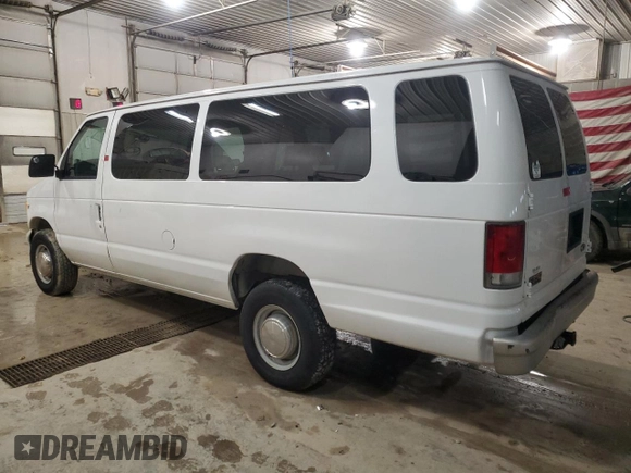 1999 Ford Econoline Passenger XL with VIN 1FBSS31L6XHA03014, listed as a Copart auction lot 88912295 with 107,472 mi miles and Salvage title. Bid and sale history available at DreamBid. Image 2.