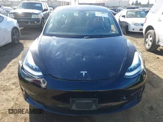 2022 Tesla Model 3 with VIN 5YJ3E1EA9NF295890, listed as a IAAI auction lot 41175917 with 42,230 mi miles and . Bid and sale history available at DreamBid. Image 13.