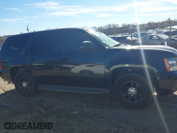 2013 Chevrolet Tahoe Commercial with VIN 1GNLC2E05DR266048, listed as a IAAI auction lot 40848505 with 95,459 mi miles and . Bid and sale history available at DreamBid. Image 13.
