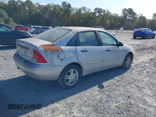 2003 Ford Focus SE z VIN 1FAFP34Z23W257426, wystawiony jako IAAI lot #40736207 z przebiegiem 87 447 mil mil oraz . Historia ofert i sprzedaży dostępna na DreamBid. Obrazek 4.