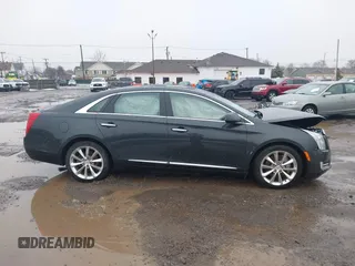 2013 Cadillac XTS Luxury z VIN 2G61R5S35D9100771, wystawiony jako IAAI lot #41673766 z przebiegiem 41 123 mil mil oraz . Historia ofert i sprzedaży dostępna na DreamBid. Obrazek 13.