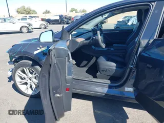 2023 Tesla Model Y Long Range with VIN 7SAYGAEE8PF976969, listed as a IAAI auction lot 41877784 with 25,896 mi miles. Bid and sale history available at carsss.com. Image 5.