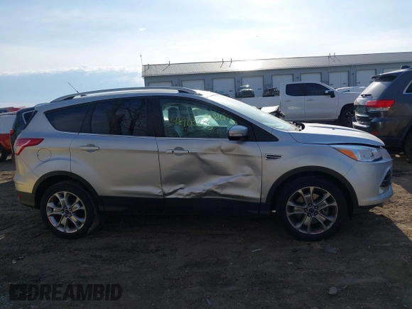 2015 Ford Escape Titanium z VIN 1FMCU0J91FUC41531, wystawiony jako IAAI lot #41903203 z przebiegiem 118 962 mil mil oraz . Historia ofert i sprzedaży dostępna na DreamBid. Obrazek 13.