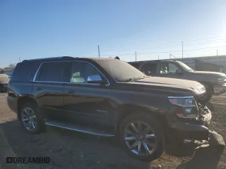 2015 Chevrolet Tahoe LTZ with VIN 1GNSKCKC6FR567840, listed as a Copart auction lot 43064285 with 131,071 mi miles and Salvage Title. Bid and sale history available at carsss.com. Image 4.
