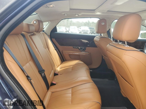 2015 Jaguar XJ Portfolio with VIN SAJWJ2GD8F8V84252, listed as a Copart auction lot 49313935 with 90,545 mi miles and Salvage title. Bid and sale history available at DreamBid. Image 10.