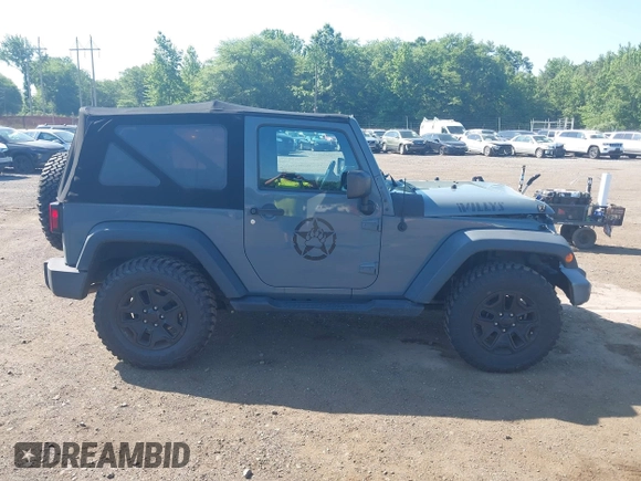 2015 Jeep Wrangler Freedom Edition with VIN 1C4AJWAG1FL714002, listed as a IAAI auction lot 42579024 with 98,732 mi miles and . Bid and sale history available at DreamBid. Image 13.