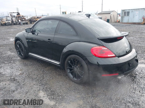 2014 Volkswagen Beetle 2.5L w/Sun with VIN 3VWJP7AT3EM608906, listed as a IAAI auction lot 41501830 with 42,804 mi miles and . Bid and sale history available at DreamBid. Image 3.