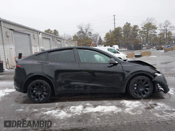 2023 Tesla Model Y Long Range with VIN 7SAYGDEE8PA183301, listed as a IAAI auction lot 41498769 with 82,893 mi miles and . Bid and sale history available at carsss.com. Image 13.