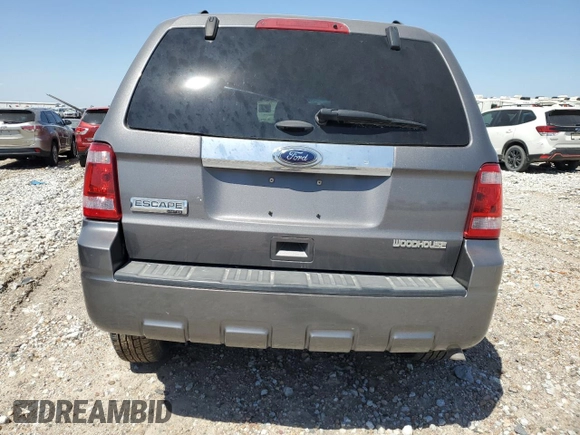 2012 Ford Escape Limited z VIN 1FMCU0E7XCKB19962, wystawiony jako Copart lot #49287765 z przebiegiem 132 747 mil mil oraz Szkoda całkowita • Salvage title. Historia ofert i sprzedaży dostępna na DreamBid. Obrazek 6.