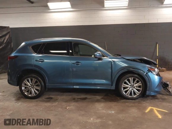 2023 Mazda CX-5 Signature with VIN JM3KFBXY4P0120187, listed as a IAAI auction lot 41706264 with 9,402 mi miles and . Bid and sale history available at carsss.com. Image 13.