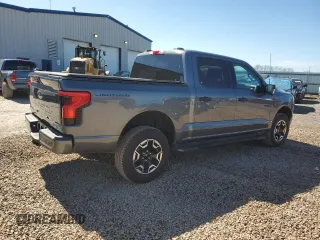 2023 Ford F-150 Lightning Pro with VIN 1FTVW1EL8PWG10894, listed as a Copart auction lot 50988655 with 34,020 mi miles and Salvage Title. Bid and sale history available at DreamBid. Image 3.