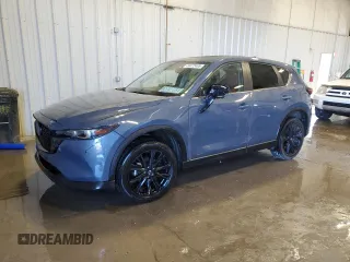 2023 Mazda CX-5 S Carbon Edition z VIN JM3KFBCM1P0224297, wystawiony jako Copart lot #49472465 z przebiegiem 34 590 mil mil oraz Szkoda całkowita • Salvage title. Historia ofert i sprzedaży dostępna na DreamBid. Obrazek 1.