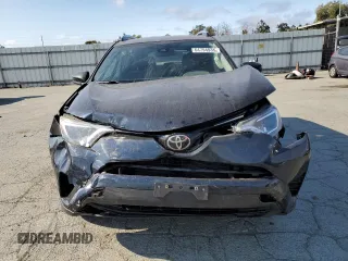 2017 Toyota RAV4 LE with VIN JTMBFREVXHJ146587, listed as a Copart auction lot 64794935 with 92,192 mi miles and Salvage title. Bid and sale history available at DreamBid. Image 5.