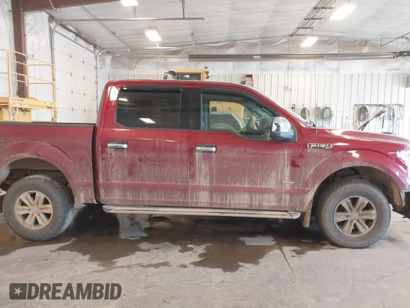 2015 Ford F-150 XLT with VIN 1FTEW1EG8FFA41398, listed as a IAAI auction lot 42102711 with 129,812 mi miles and . Bid and sale history available at DreamBid. Image 13.