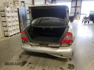 2007 Mercedes-Benz E 550 with VIN WDBUF72X97B017766, listed as a Copart auction lot 48523515 with 299,578 mi miles and Salvage Title. Bid and sale history available at DreamBid. Image 6.