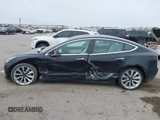2018 Tesla Model 3 Long Range Battery with VIN 5YJ3E1EB9JF188437, listed as a IAAI auction lot 41371254 with 55,934 mi miles and . Bid and sale history available at DreamBid. Image 14.