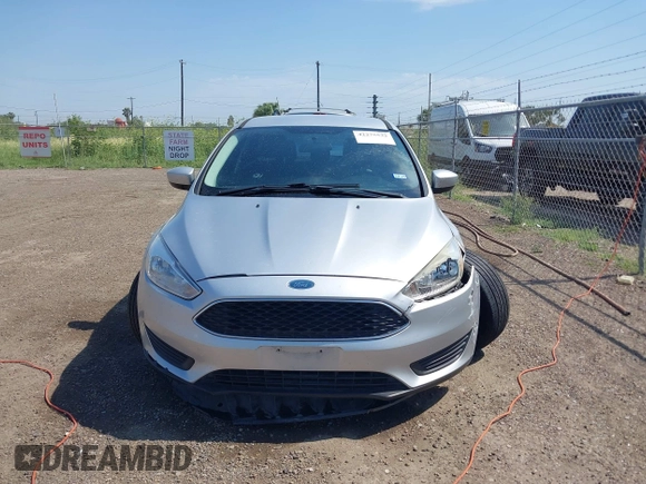 2018 Ford Focus SE z VIN 1FADP3FE0JL321530, wystawiony jako IAAI lot #42275532 z przebiegiem 65 412 mil mil oraz . Historia ofert i sprzedaży dostępna na DreamBid. Obrazek 12.