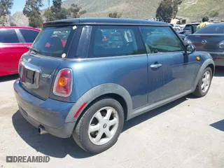 2010 MINI Cooper Hardtop with VIN WMWMF3C56ATZ24156, listed as a IAAI auction lot 41997887 with 149,308 mi miles. Bid and sale history available at carsss.com. Image 4.
