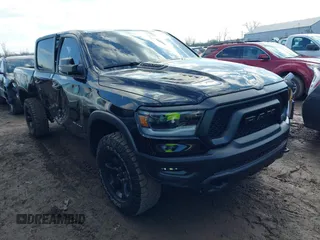 2023 Ram 1500 Rebel with VIN 1C6SRFLT7PN622851, listed as a IAAI auction lot 41660752 with 20,521 mi miles and . Bid and sale history available at DreamBid. Image 1.