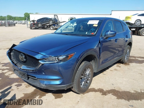 2020 Mazda CX-5 Touring z VIN JM3KFBCM2L0848233, wystawiony jako IAAI lot #42189719 z przebiegiem 80 893 mil mil oraz . Historia ofert i sprzedaży dostępna na DreamBid. Obrazek 18.