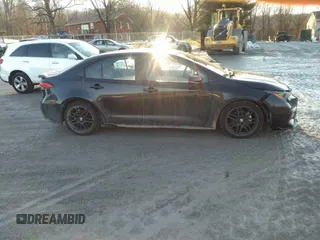 2021 Toyota Corolla SE with VIN 5YFS4MCE9MP090031, listed as a IAAI auction lot 41335232 with 57,128 mi miles. Bid and sale history available at carsss.com. Image 13.