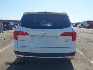 2018 Honda Pilot Touring with VIN 5FNYF6H95JB019122, listed as a IAAI auction lot 42439283 with 128,848 mi miles and . Bid and sale history available at DreamBid. Image 16.