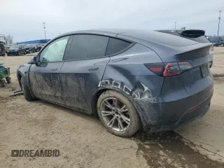 2023 Tesla Model Y Long Range z VIN 7SAYGDEE3PF884220, wystawiony jako Copart lot #52072605 z przebiegiem 44 996 mil mil oraz Czysty tytuł • Clean title. Historia ofert i sprzedaży dostępna na DreamBid. Obrazek 2.