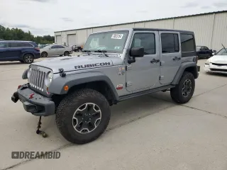 2013 Jeep Wrangler Unlimited Rubicon 10th Anniversary with VIN 1C4HJWFG3DL703331, listed as a Copart auction lot 70823154 with 148,860 mi miles and Salvage title. Bid and sale history available at DreamBid. Image 1.