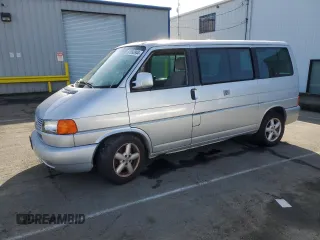 2003 Volkswagen EuroVan MV with VIN WV2MB47003H042703, listed as a Copart auction lot 87093944 with 127,872 mi miles and Salvage Title. Bid and sale history available at DreamBid. Image 1.
