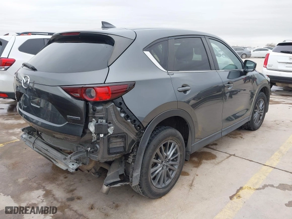 2021 Mazda CX-5 Touring with VIN JM3KFBCM0M0342210, listed as a IAAI auction lot 41236013 with 96,012 mi miles. Bid and sale history available at carsss.com. Image 4.