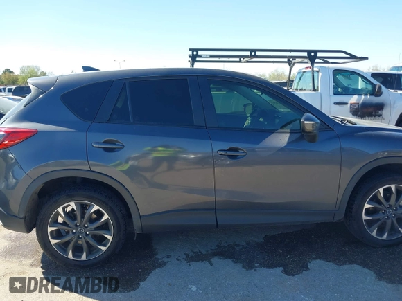 2016 Mazda CX-5 Grand Touring with VIN JM3KE2DYXG0784615, listed as a IAAI auction lot 41846853 with 72,185 mi miles. Bid and sale history available at carsss.com. Image 13.