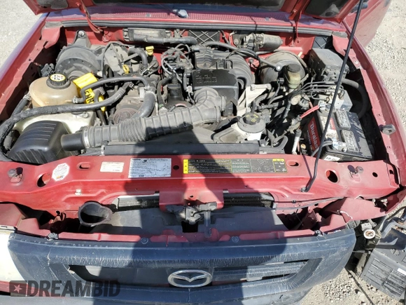 2004 Mazda B-Series Truck z VIN 4F4YR12D04TM00151, wystawiony jako Copart lot #54262875 z przebiegiem 189 201 mil mil oraz Szkoda całkowita • Salvage title. Historia ofert i sprzedaży dostępna na DreamBid. Obrazek 11.